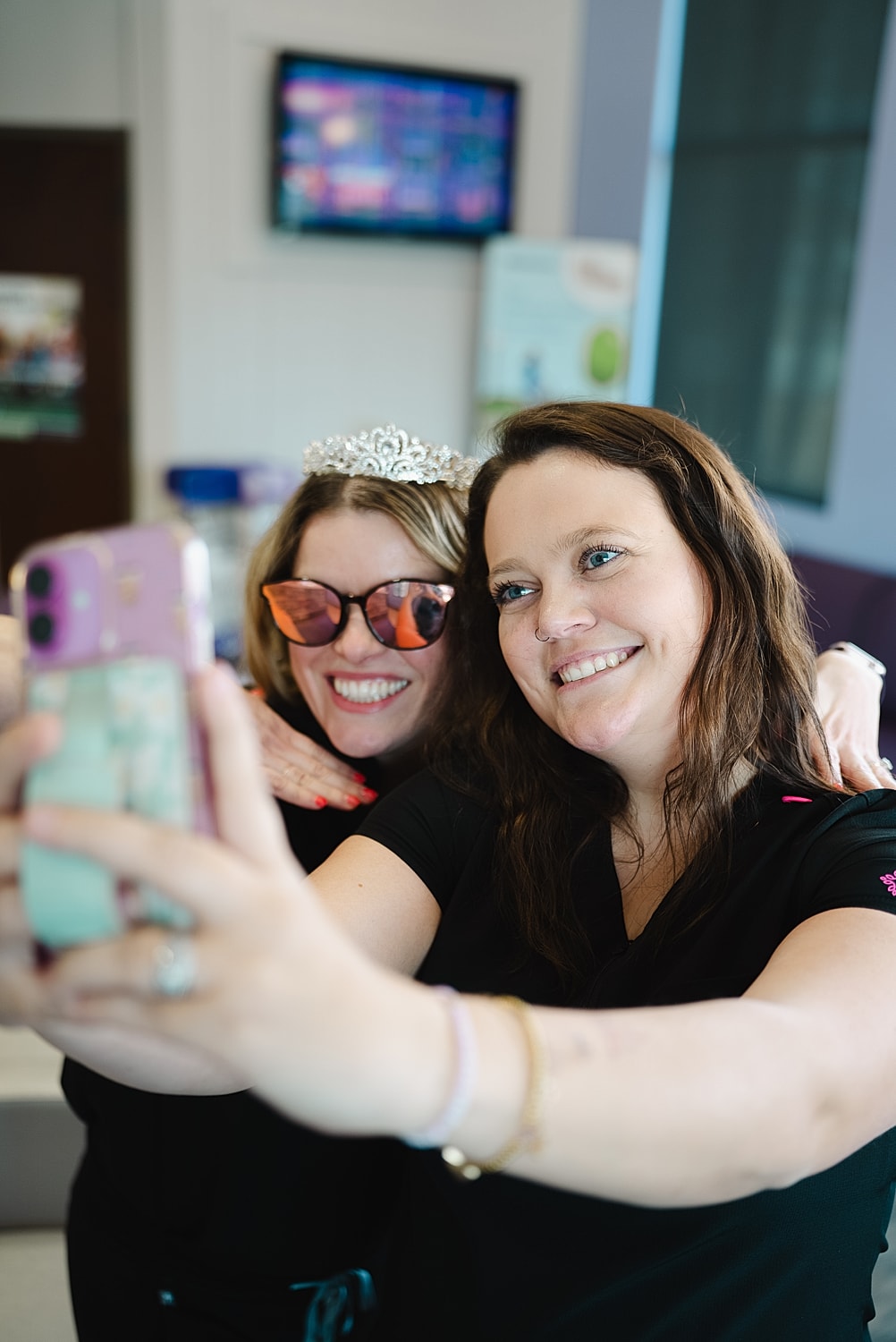 Two friends taking a selfie together.