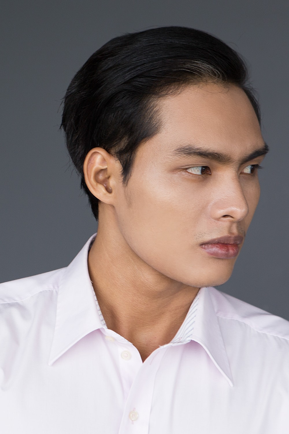 Portrait of a young man looking sideways.